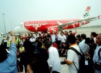 Carabao pose for the press in front of the specially painted plane